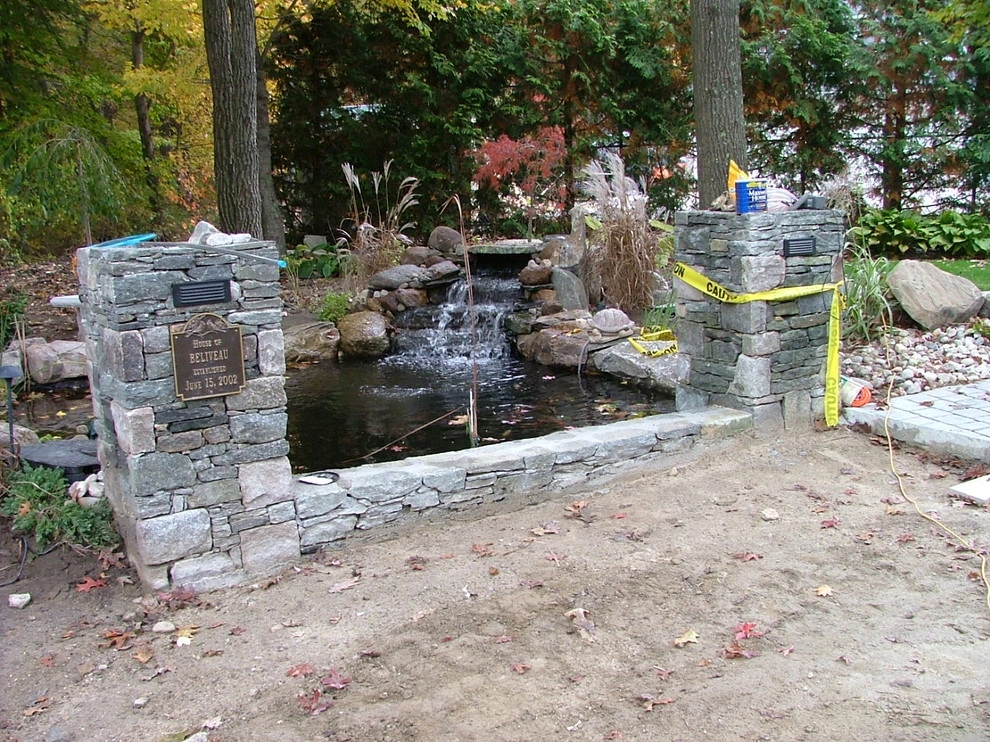 Main driveway with koi ponds on both sides . by Koi Villa Water Garden Center - Photo 27