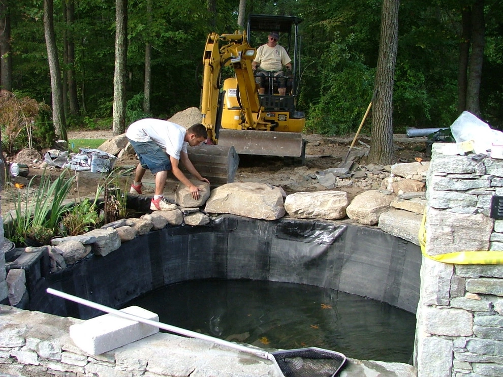 Main driveway with koi ponds on both sides . by Koi Villa Water Garden Center - Photo 18