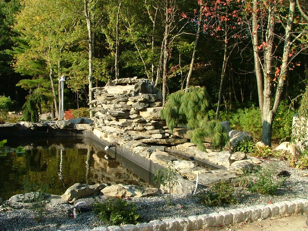 Main driveway with koi ponds on both sides . by Koi Villa Water Garden Center - Photo 21