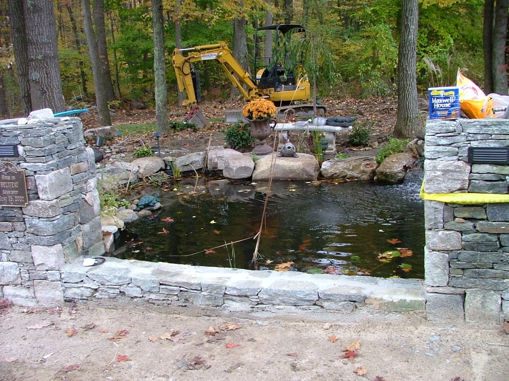 Main driveway with koi ponds on both sides . by Koi Villa Water Garden Center - Photo 9
