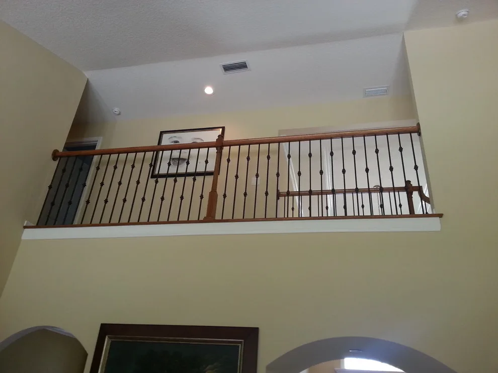 Wrought Iron Stair Renovations by Elite Construction Of Jax, Inc. - Photo 9