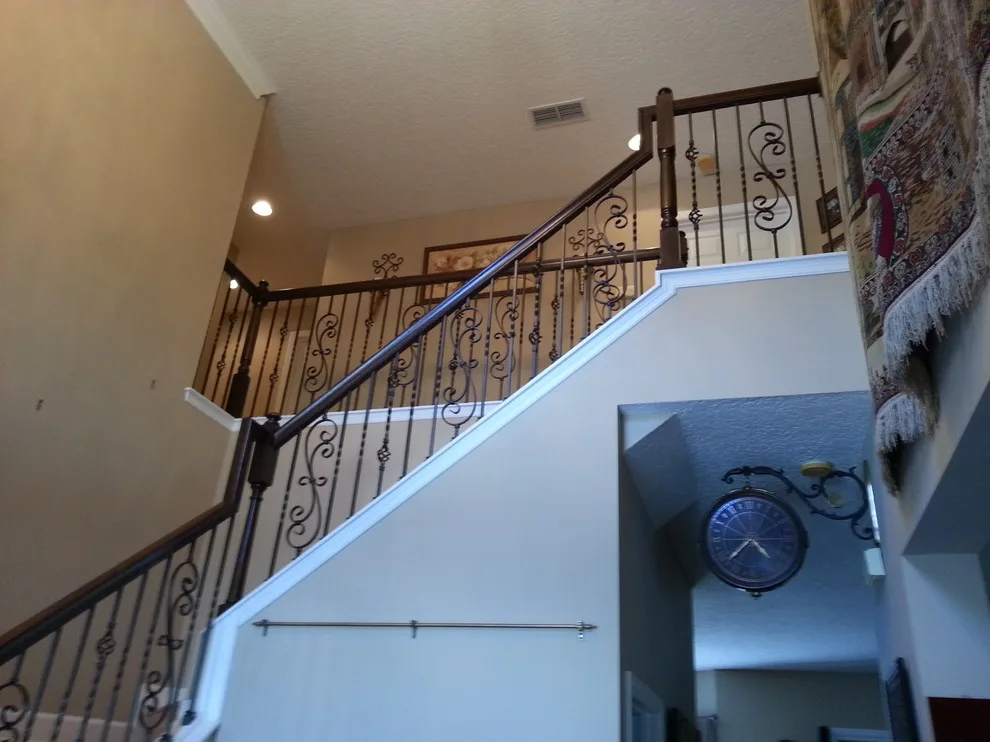 Wrought Iron Stair Renovations by Elite Construction Of Jax, Inc. - Photo 12