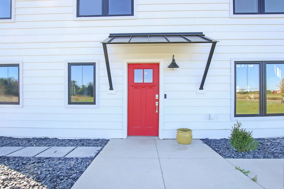 Contemporary Farmhouse Embracing Sunlight by R-Value Homes - Photo 32