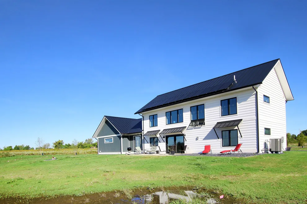 Contemporary Farmhouse Embracing Sunlight by R-Value Homes - Photo 21