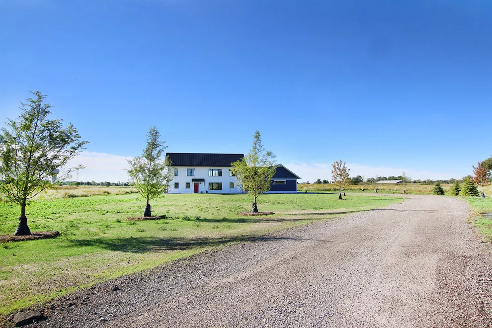 Contemporary Farmhouse Embracing Sunlight by R-Value Homes - Photo 28