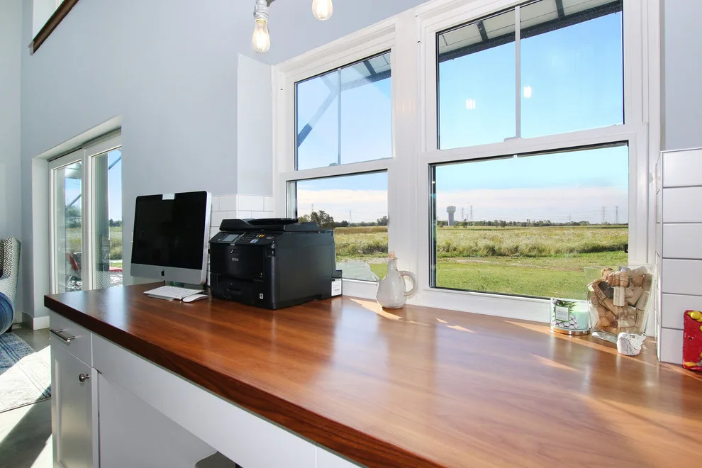 Contemporary Farmhouse Embracing Sunlight by R-Value Homes - Photo 23