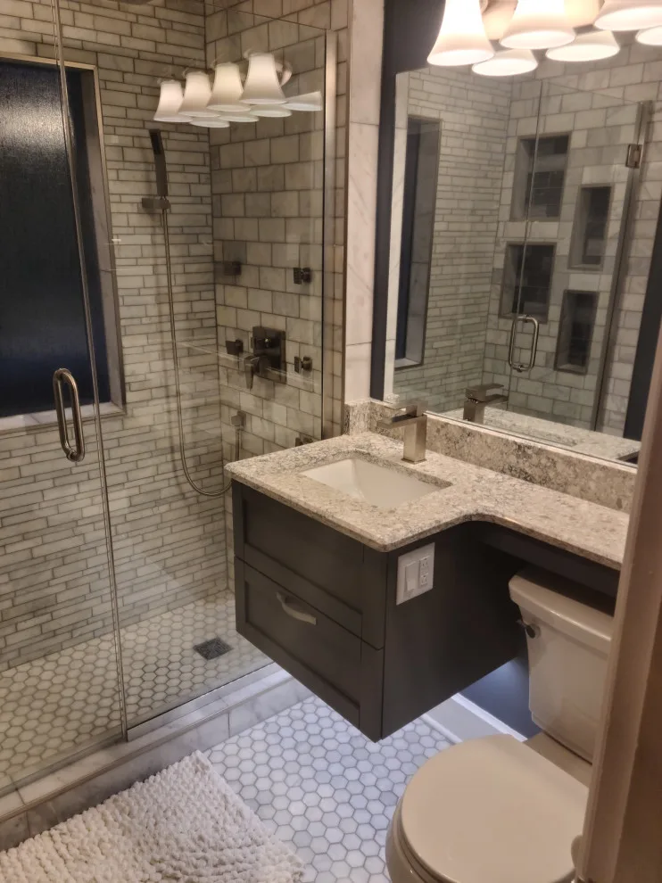 Revamping a Classic Bathroom by Empire Homes And Remodeling Inc. - Photo 11