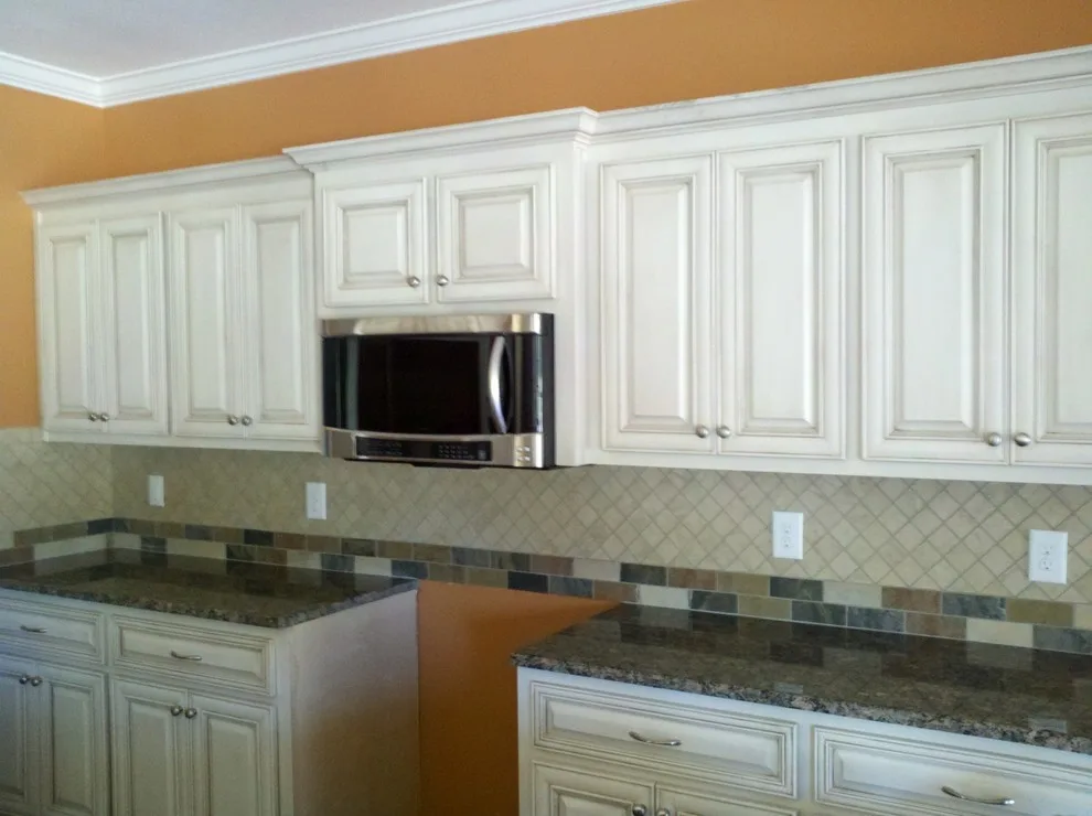 Ivory Kitchen Backsplash with Tumbled Stone by Floor Pro South, LLC - Photo 4