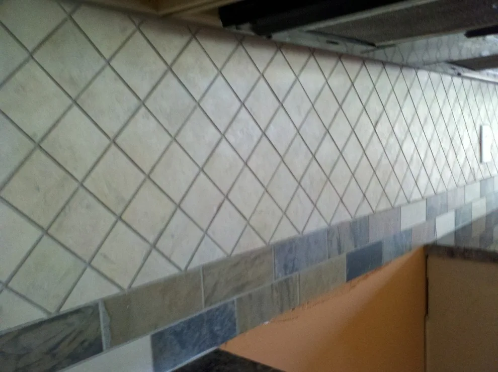 Ivory Kitchen Backsplash with Tumbled Stone by Floor Pro South, LLC - Photo 3