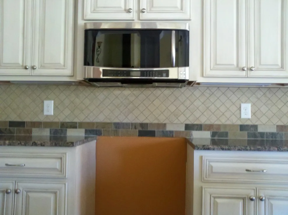 Ivory Kitchen Backsplash with Tumbled Stone by Floor Pro South, LLC - Photo 2