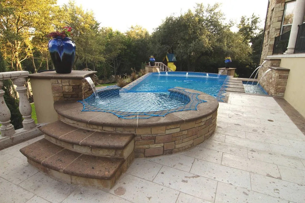 Cantera Stone Exterior Swimming Pool by Rustico Tile & Stone - Photo 4