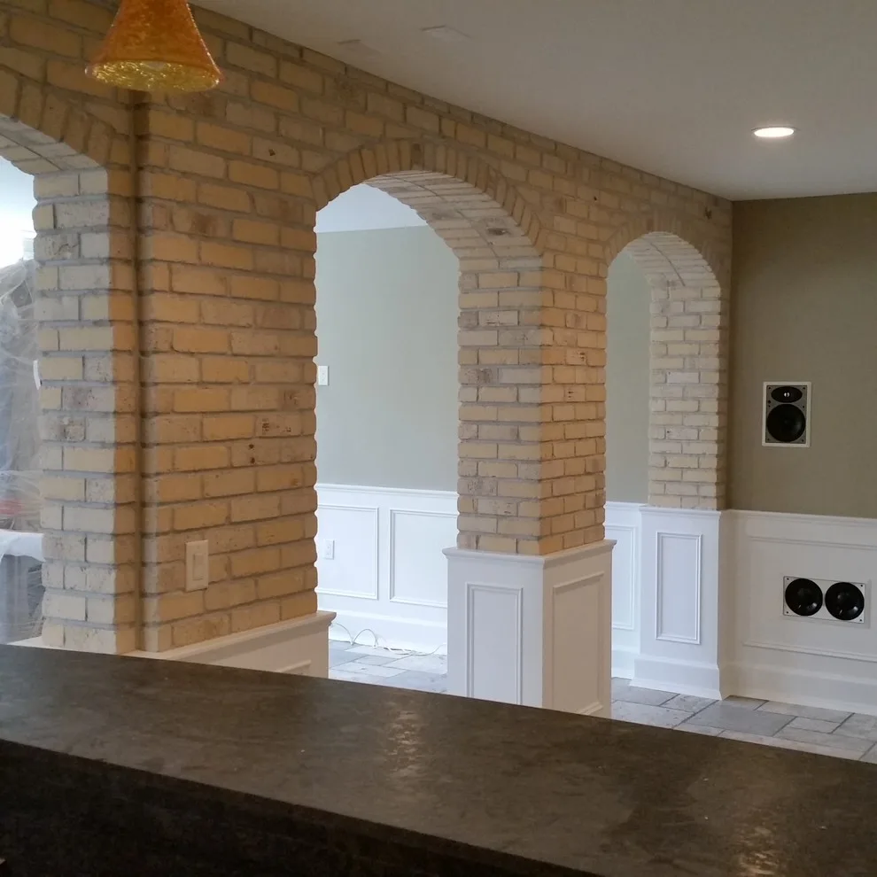 slim brick facade and marble flooring by Heinrichs Custom Tile And Stone - Photo 6