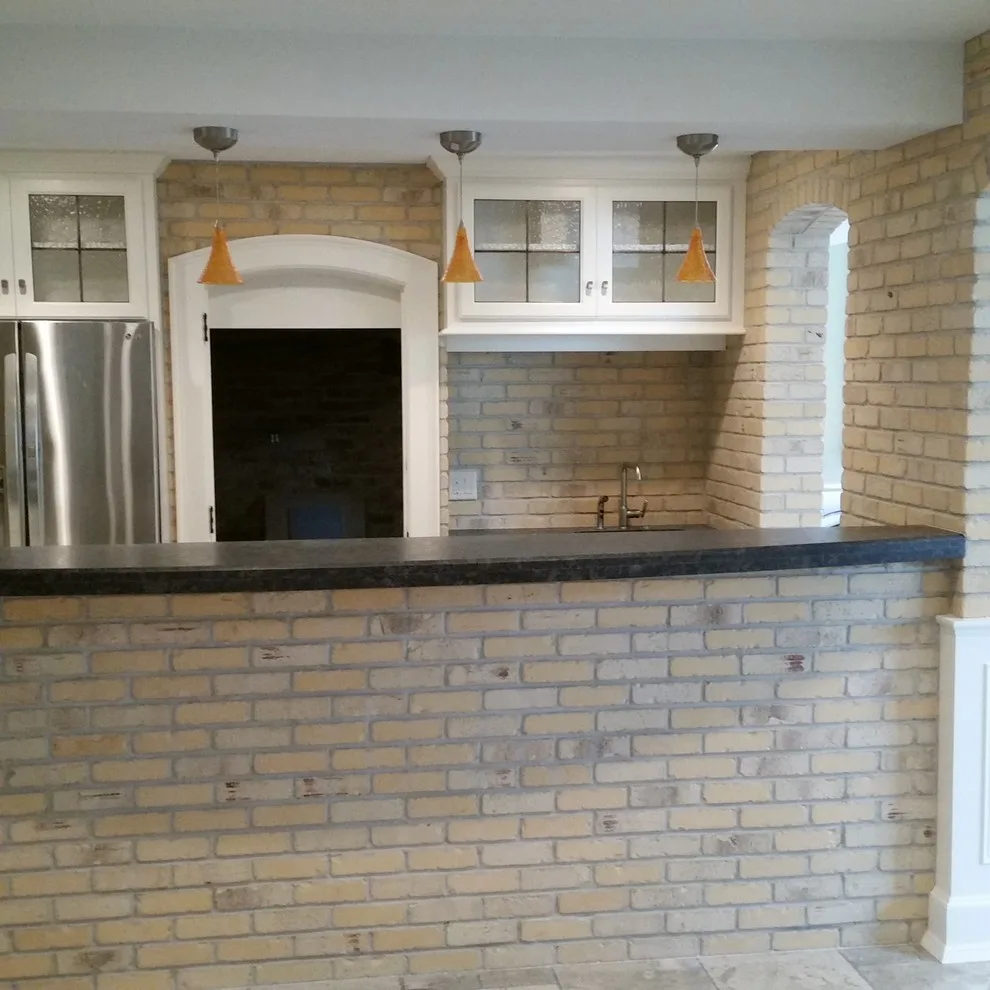 slim brick facade and marble flooring by Heinrichs Custom Tile And Stone - Photo 5
