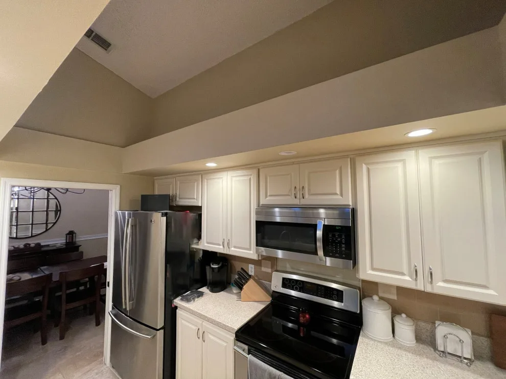 A Beautiful Kitchen Makeover Featuring Timeless White Cabinets by Kitchen Solvers Of The Gulf Coast - Photo 14