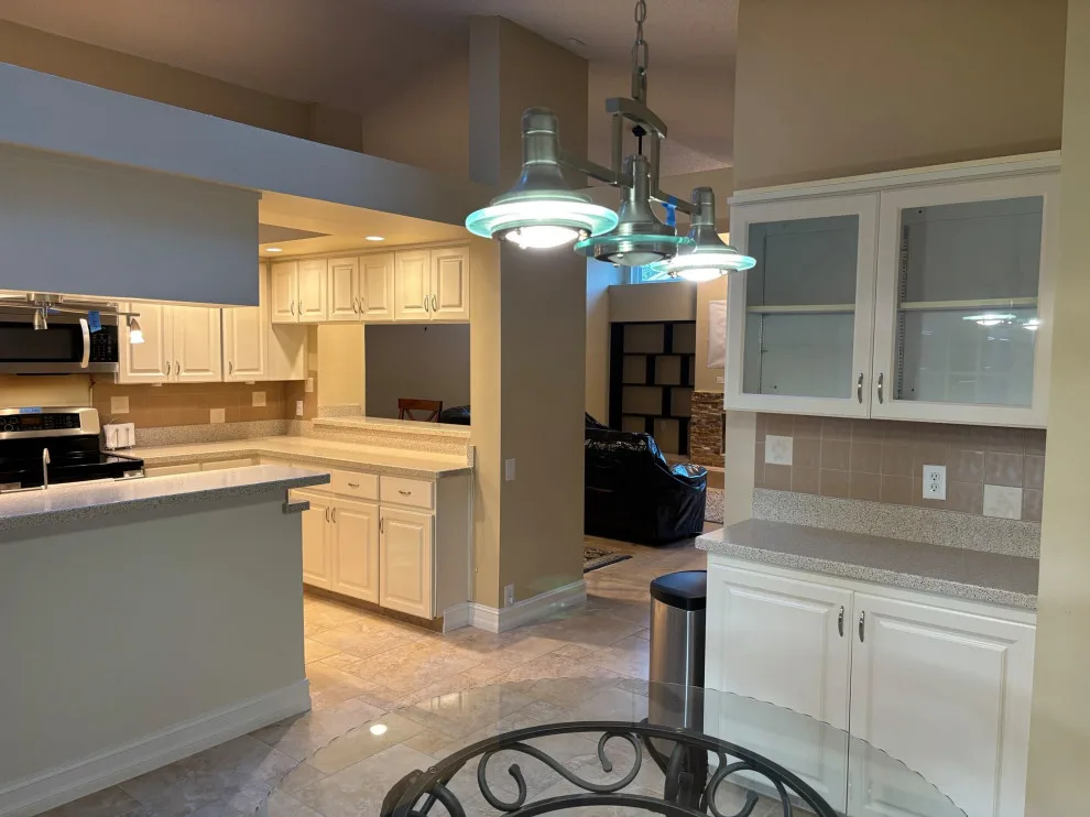 A Beautiful Kitchen Makeover Featuring Timeless White Cabinets by Kitchen Solvers Of The Gulf Coast - Photo 12