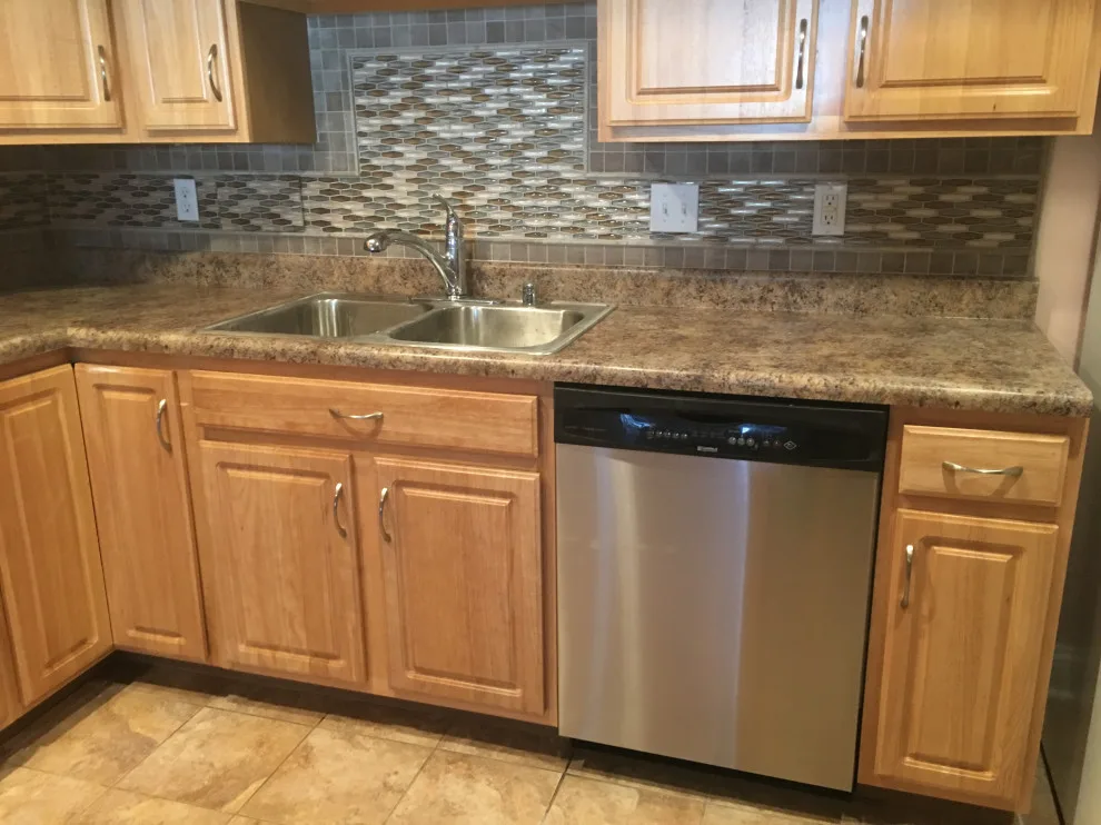 Basement apartment backsplash, updated master bathroom, bedroom flooring by Spencer Remodeling - Photo 8