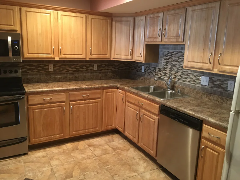 Basement apartment backsplash, updated master bathroom, bedroom flooring by Spencer Remodeling - Photo 9