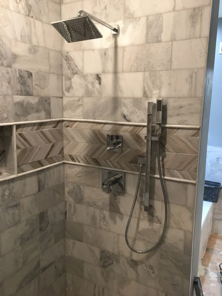 Basement apartment backsplash, updated master bathroom, bedroom flooring by Spencer Remodeling - Photo 6