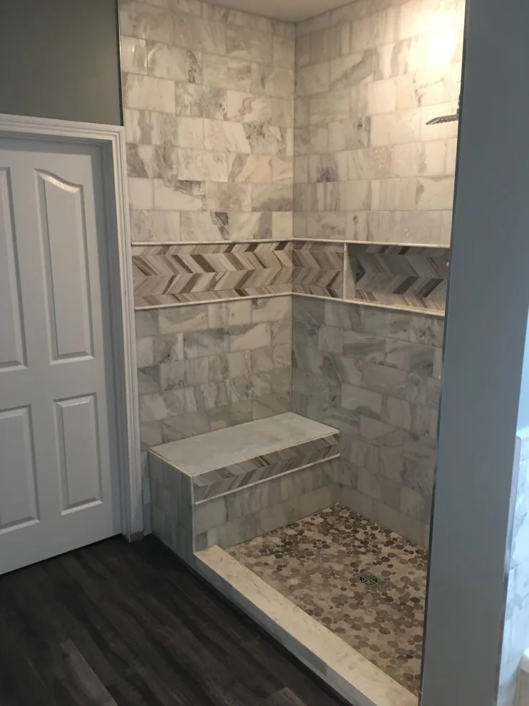 Basement apartment backsplash, updated master bathroom, bedroom flooring by Spencer Remodeling - Photo 7