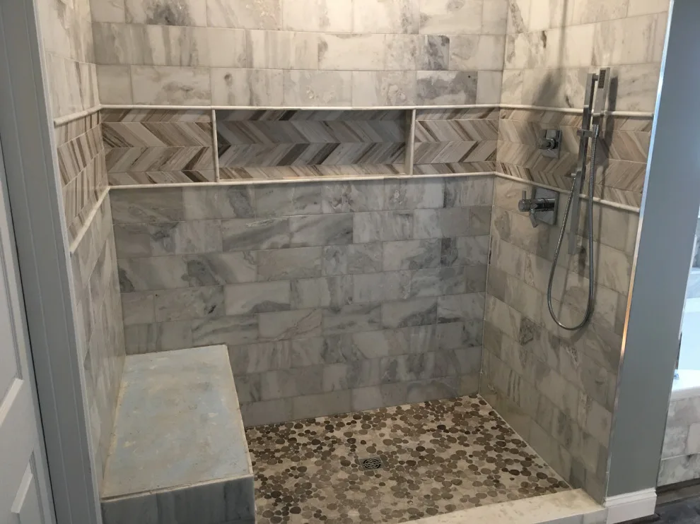 Basement apartment backsplash, updated master bathroom, bedroom flooring by Spencer Remodeling - Photo 5