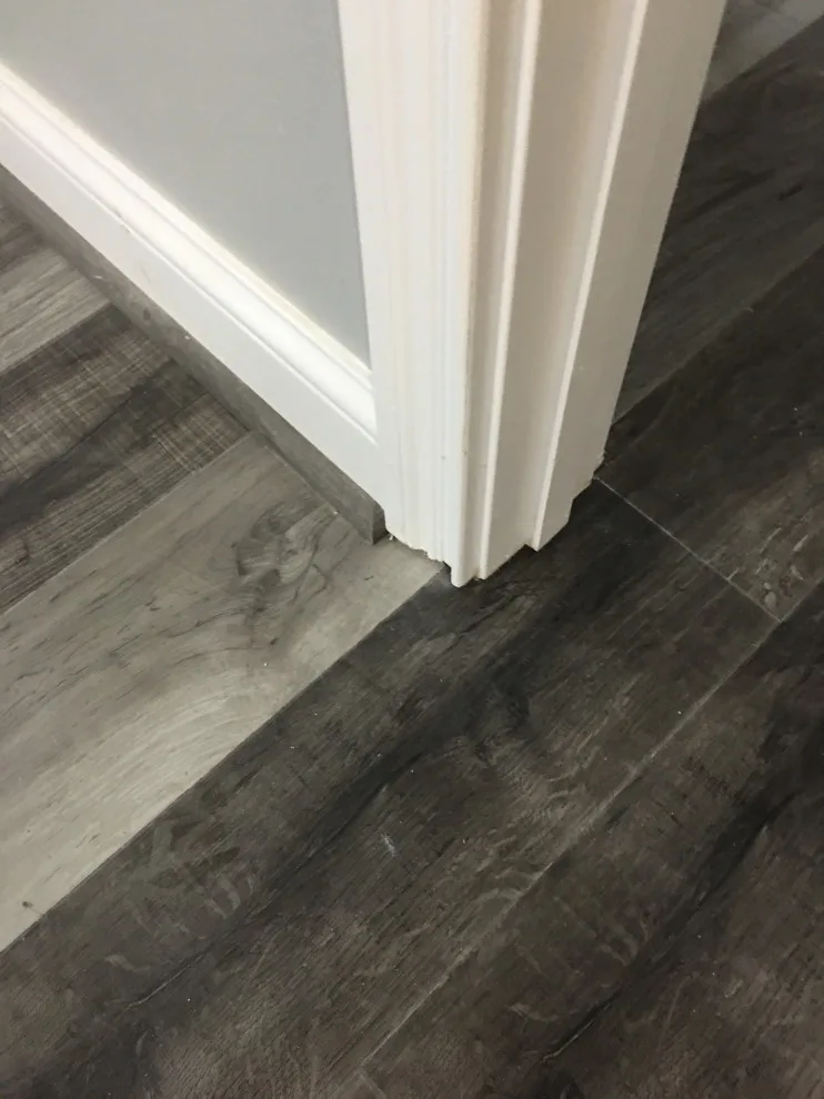 Basement apartment backsplash, updated master bathroom, bedroom flooring by Spencer Remodeling - Photo 13