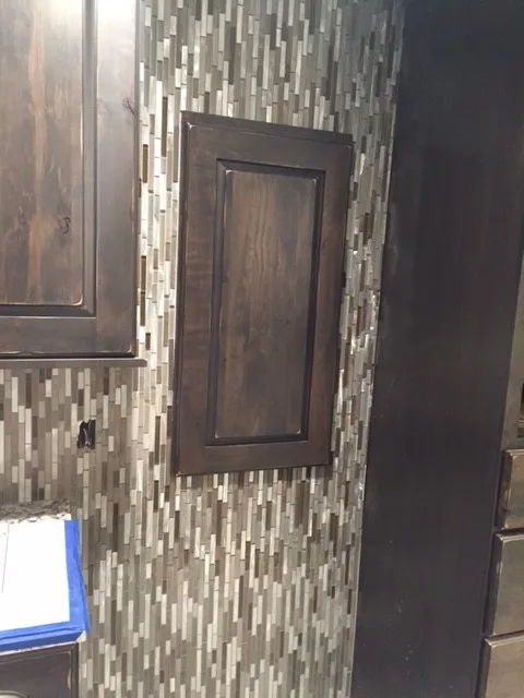 Lower-level lounge flooring and bar wall finish by Master Bath Specialists - Photo 5