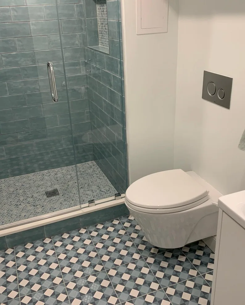 Basement Renovation: Newly Constructed Bathroom and Laundry Area by K & M Flooring-Renovations Inc. - Photo 3