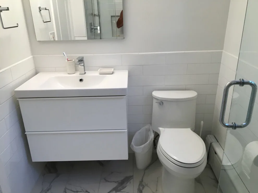 Radiant and Airy Bathroom Renovation by K & M Flooring-Renovations Inc. - Photo 2