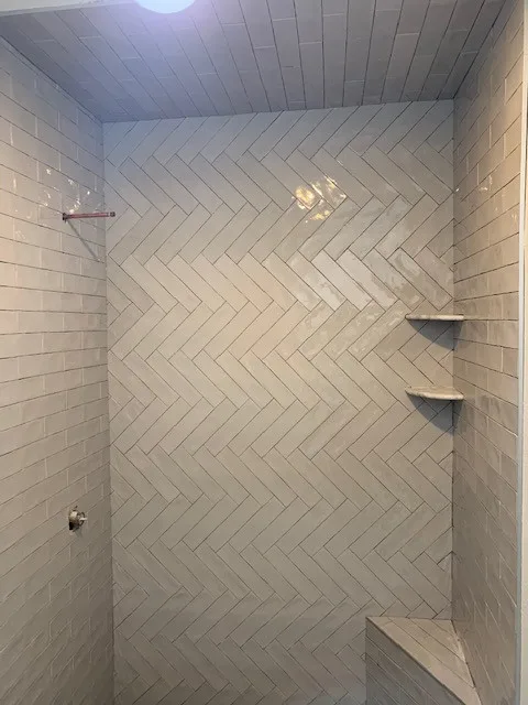 Restrooms by WHI Construction & Remodeling - Photo 11