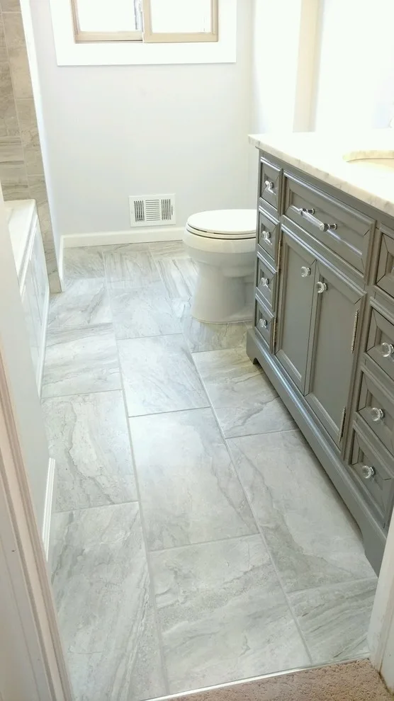 White Marble Vanity in the Bathroom by July's Quality Construction & Remodeling - Photo 3