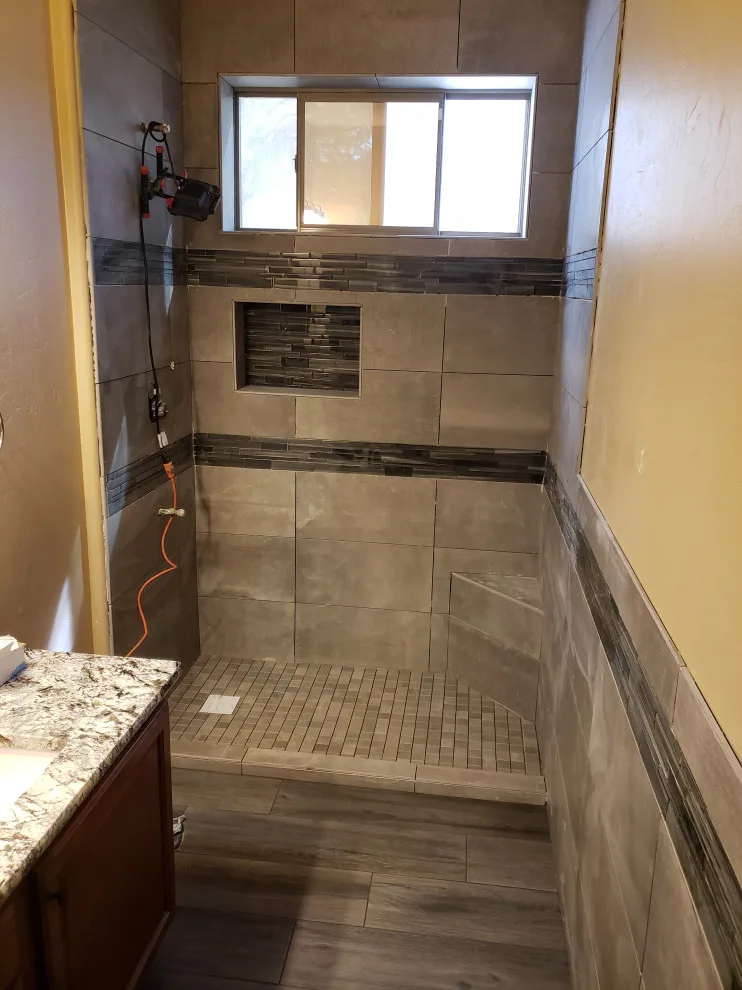 Restrooms by Envision Tile & Stone LLC - Photo 15