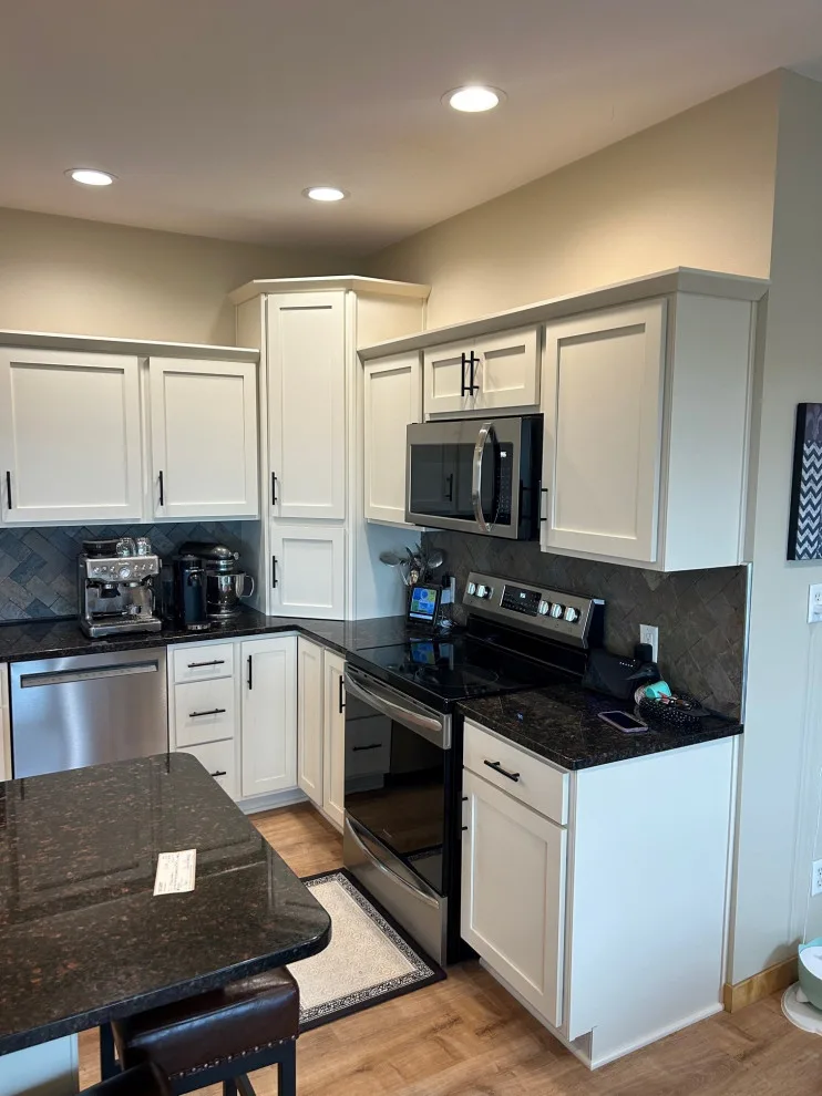 Elegant Kitchen Renovation Featuring Ivory Cabinets by Kitchen Solvers Of Eau Claire - Photo 3