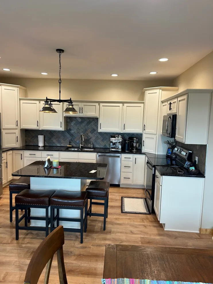 Elegant Kitchen Renovation Featuring Ivory Cabinets by Kitchen Solvers Of Eau Claire - Photo 5