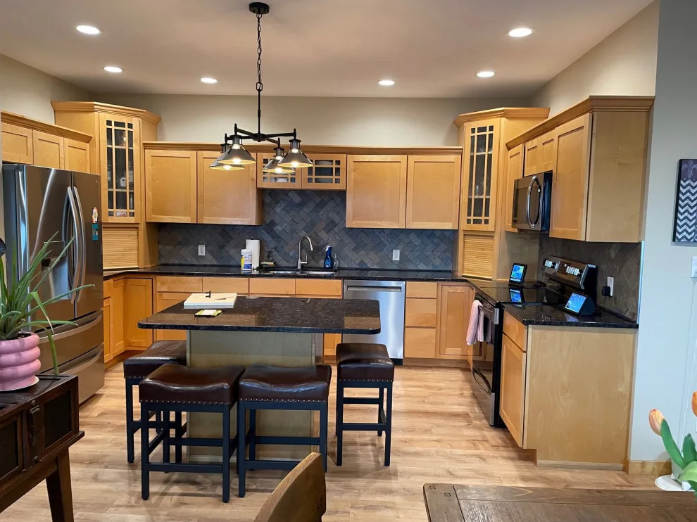 Elegant Kitchen Renovation Featuring Ivory Cabinets by Kitchen Solvers Of Eau Claire - Photo 2