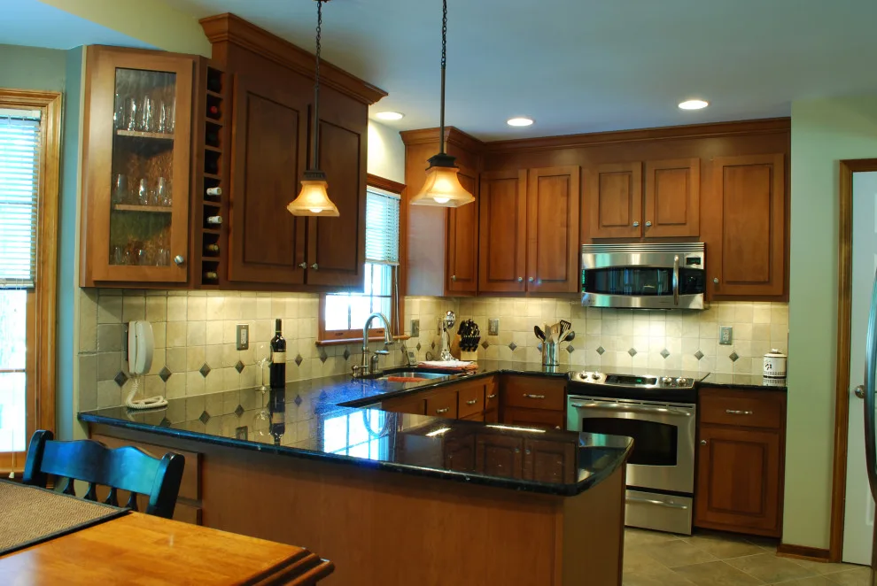 Elegant Kitchen Makeover Executed in Alder with a Honey Finish by Kitchen Solvers Of Grayslake - Photo 4