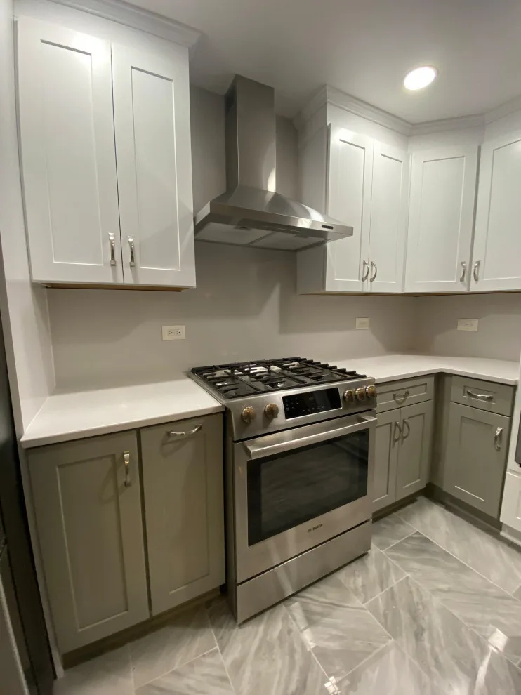 Stunning Kitchen Makeover Featuring Dual-Colored Cabinets by Kitchen Solvers Of Grayslake - Photo 13