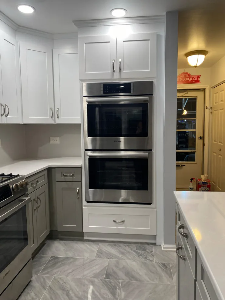Stunning Kitchen Makeover Featuring Dual-Colored Cabinets by Kitchen Solvers Of Grayslake - Photo 19