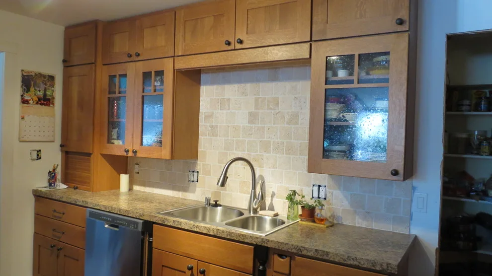 Kitchen renovation for a galley layout by Skyline Remodeling - Photo 11
