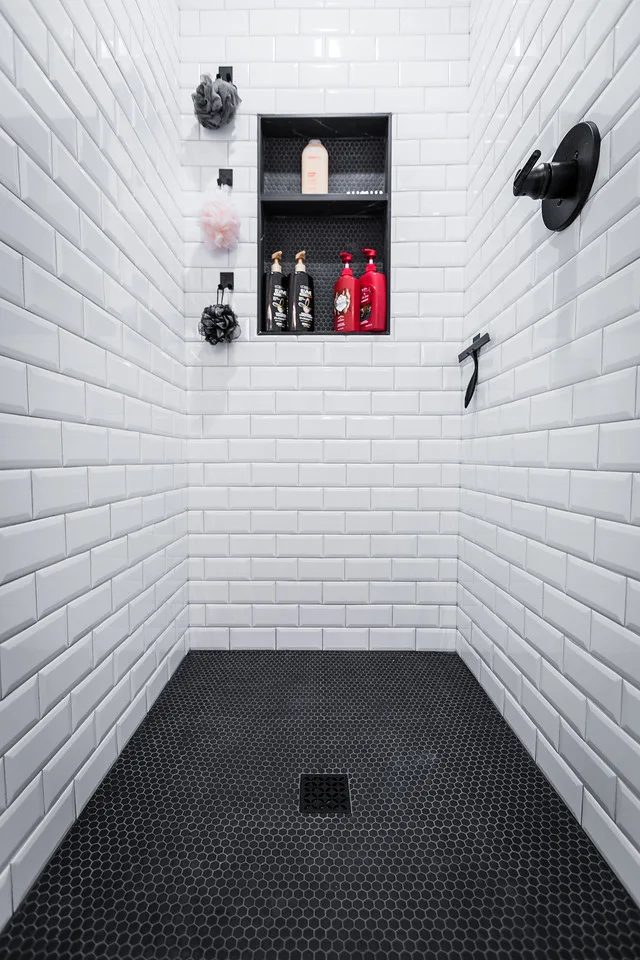 Brass and Black Bold Bathroom by NextGen Remodeling LLC - Photo 11