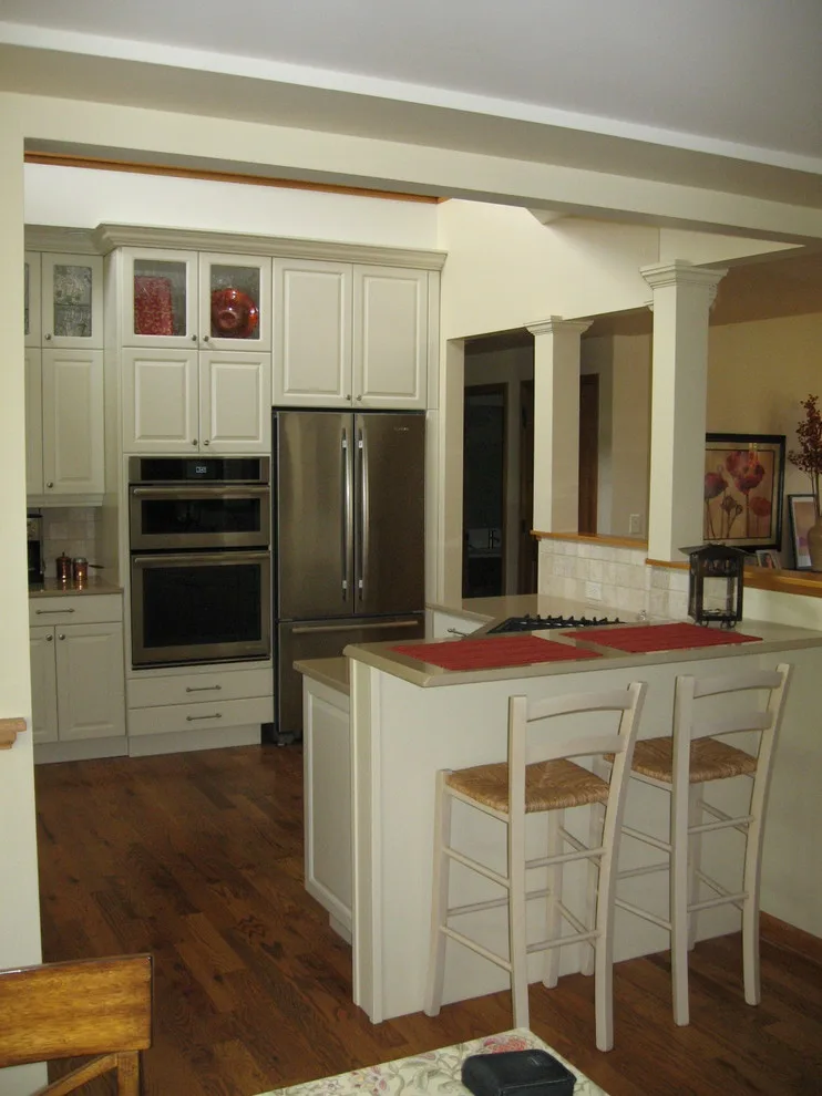 Radiant White Kitchen Renovation by Kitchen & Bath Design Center - Photo 13