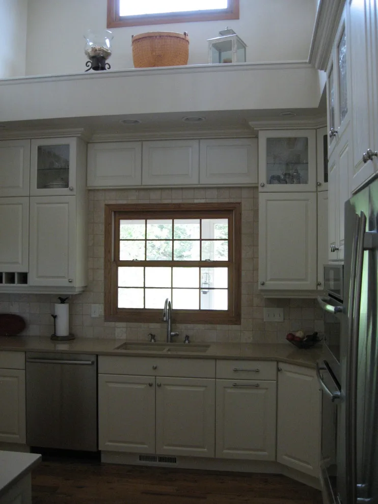 Radiant White Kitchen Renovation by Kitchen & Bath Design Center - Photo 17