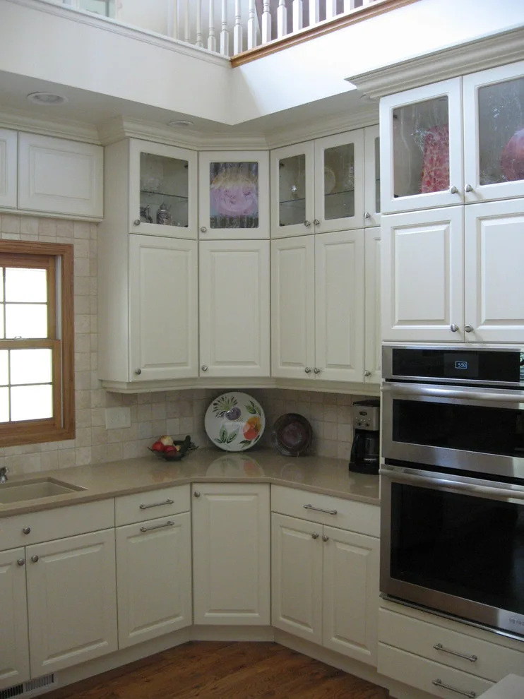 Radiant White Kitchen Renovation by Kitchen & Bath Design Center - Photo 21