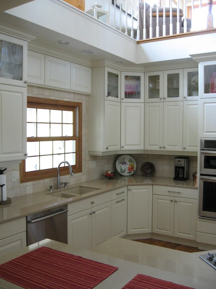 Radiant White Kitchen Renovation by Kitchen & Bath Design Center - Photo 27