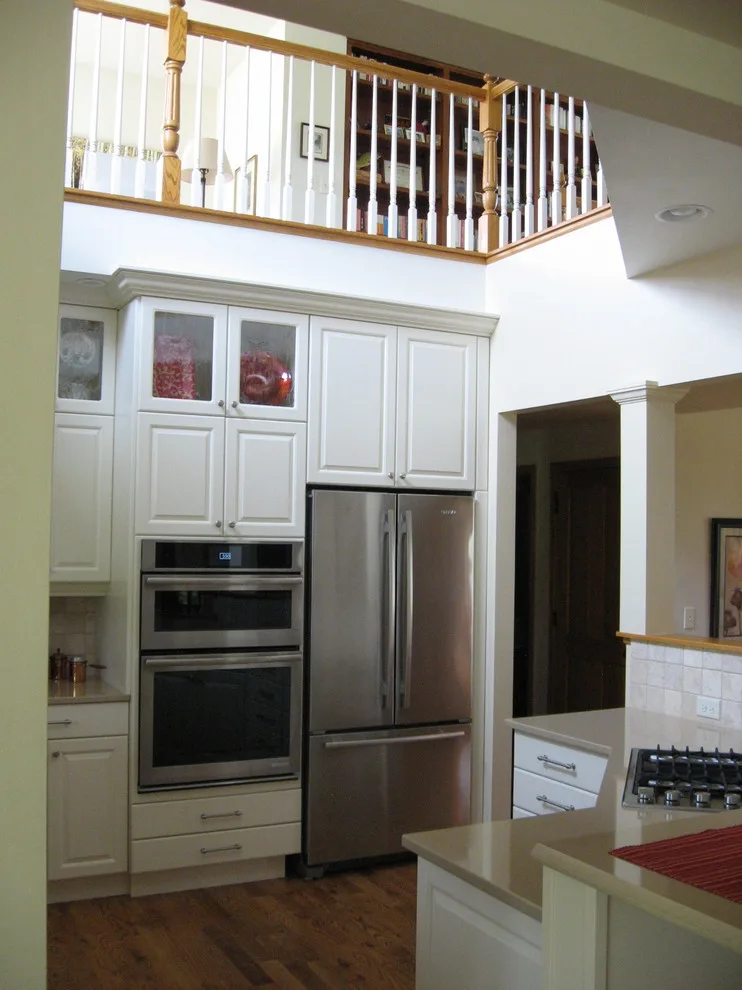 Radiant White Kitchen Renovation by Kitchen & Bath Design Center - Photo 29