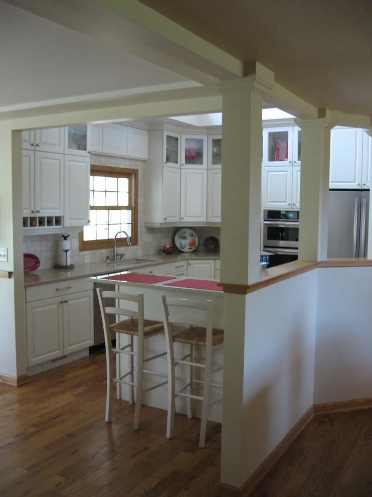 Radiant White Kitchen Renovation by Kitchen & Bath Design Center - Photo 16