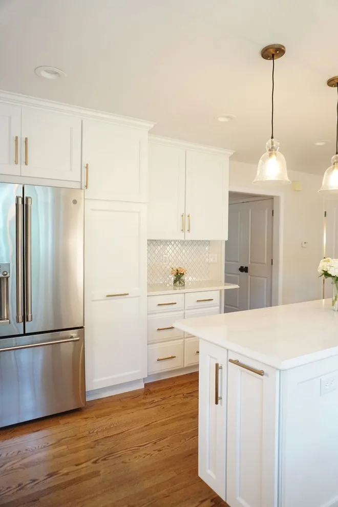 Luminous White Kitchen Renovation by Affordable Kitchens & Baths - Photo 11