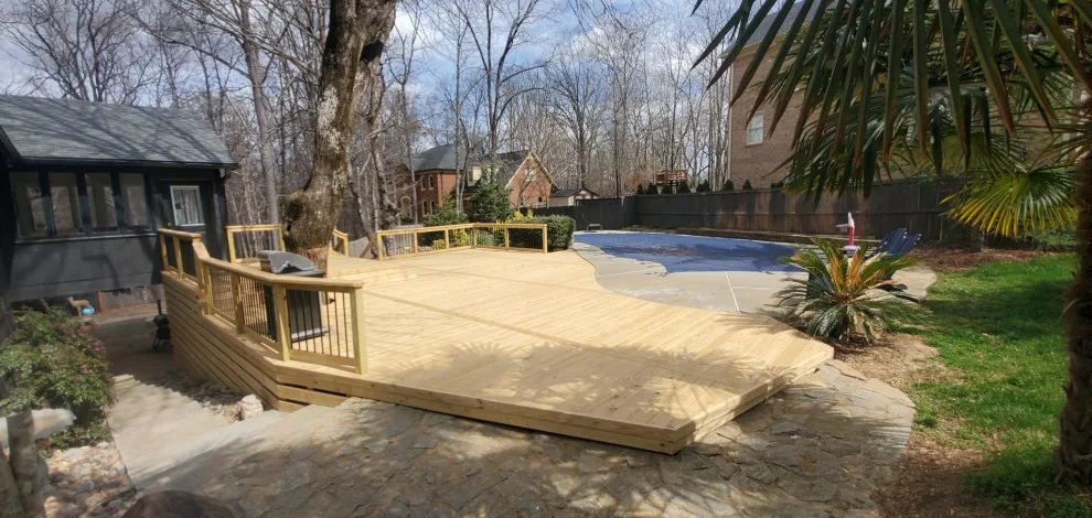 1,000 Sq ft multi-tiered pool deck with trim and aluminum railing by Grand Outdoor Living Design - Photo 2
