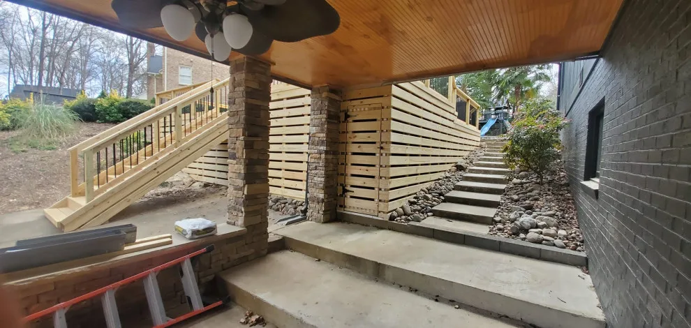 1,000 Sq ft multi-tiered pool deck with trim and aluminum railing by Grand Outdoor Living Design - Photo 3