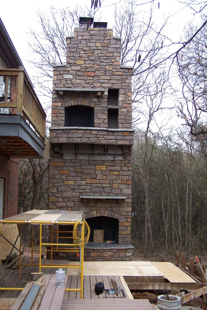 Two-Level Deck Featuring Dual Fireplaces by Contracting In Carpentry LLC - Photo 8