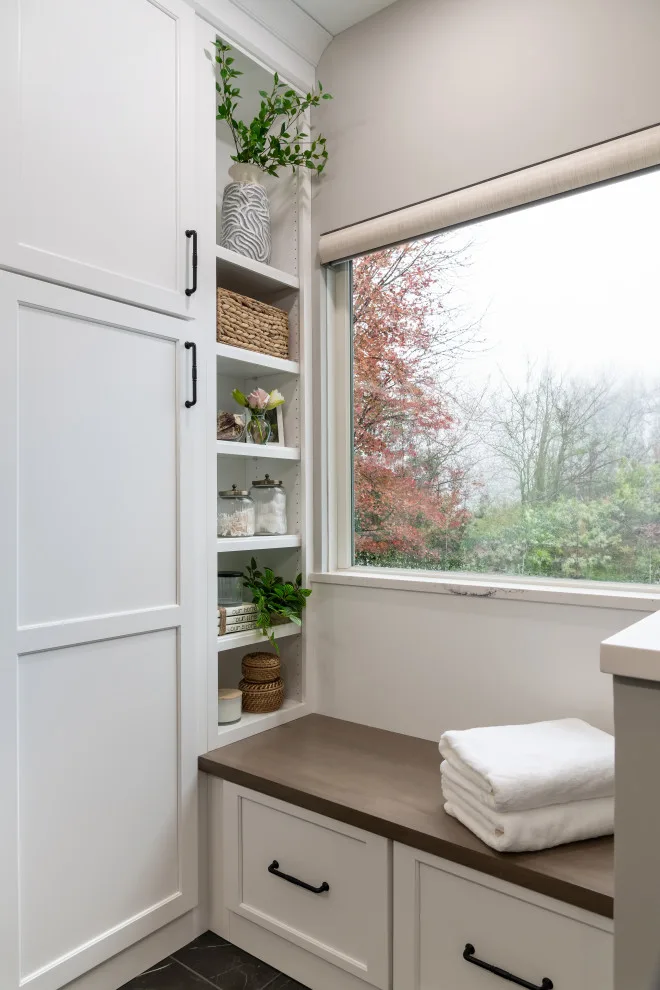 Stylish bathroom featuring smart storage solutions and artistic design elements by Liston Design Build - Photo 5